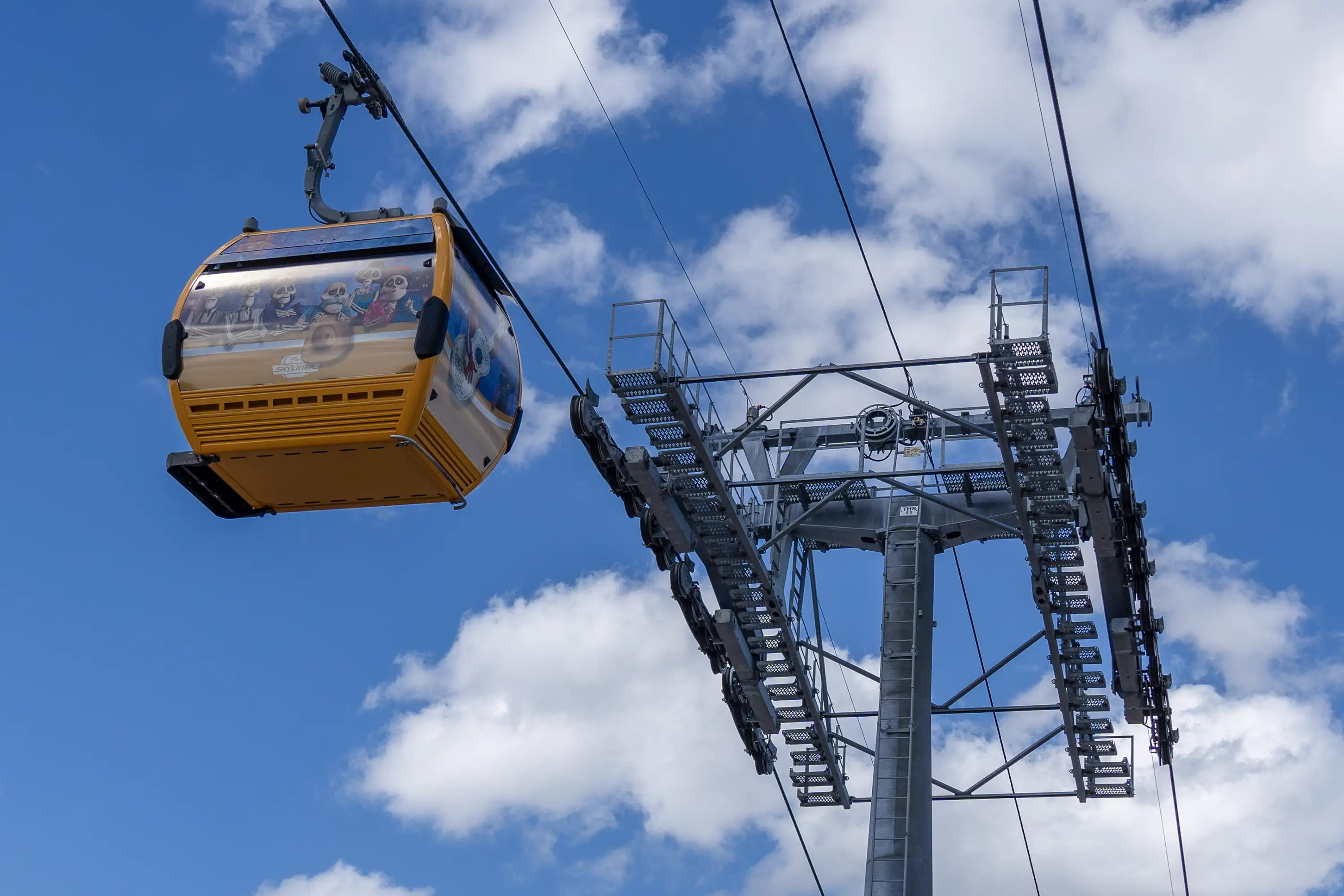 Disney Skyliner gondola passing overhead