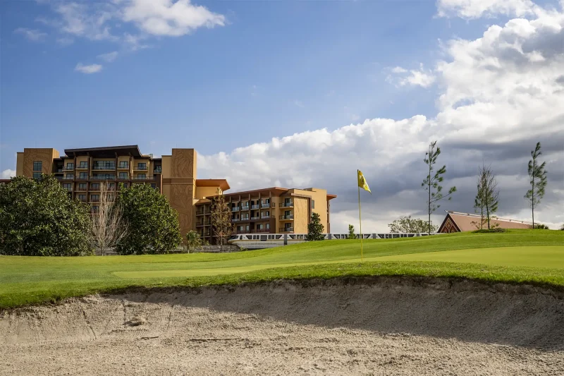 Disney's Magnolia golf course with the Polynesian Island Tower in the distance