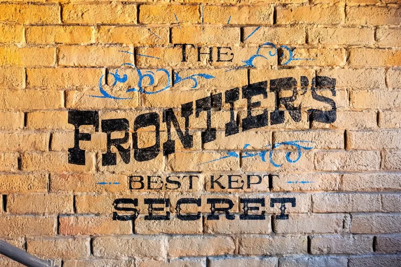 McKim's Mile House mural that says The Frontier's Best Kept Secret