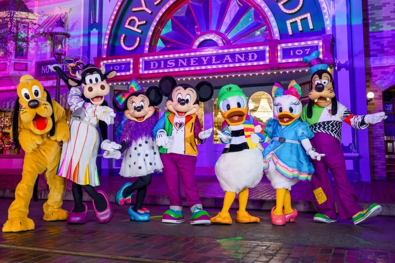 Disney characters dressed for Pride Nite