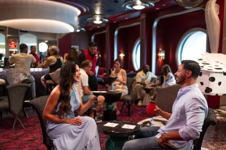 Guests enjoying De Vil's on the Disney Destiny