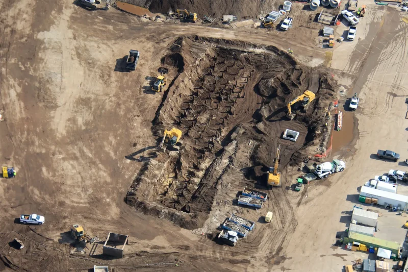 An aerial shot of dozens of concrete auger cast pilings