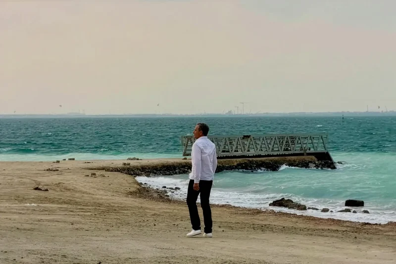 Bob Iger is walking on a Yas Island beach, the future home Disneyland Abu Dhabi