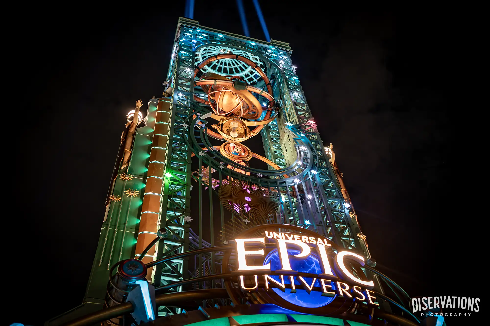 Epic Universe's Chronos Tower lit up at night