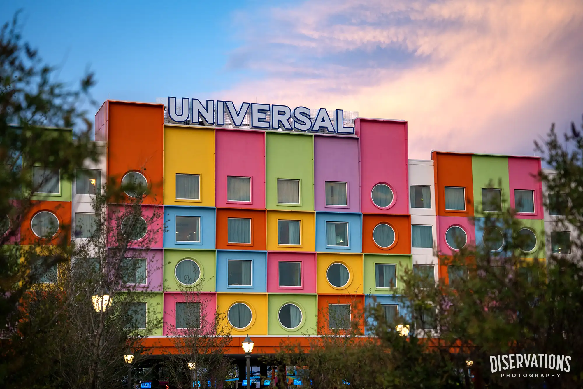 Universal Kids Resort beneath a beautiful blue, pink, and purple sky