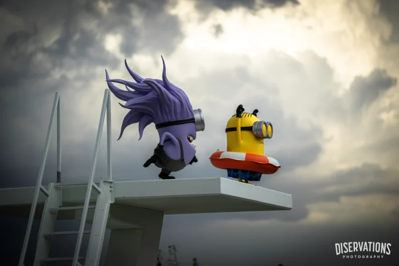 Purple and Yellow Minions statues decorating the Bello Bay Cruise at Universal Kids Resort