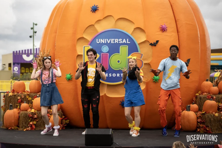 The cast of Monster Tots Superfan Spooktacular and an enormous pumpkin