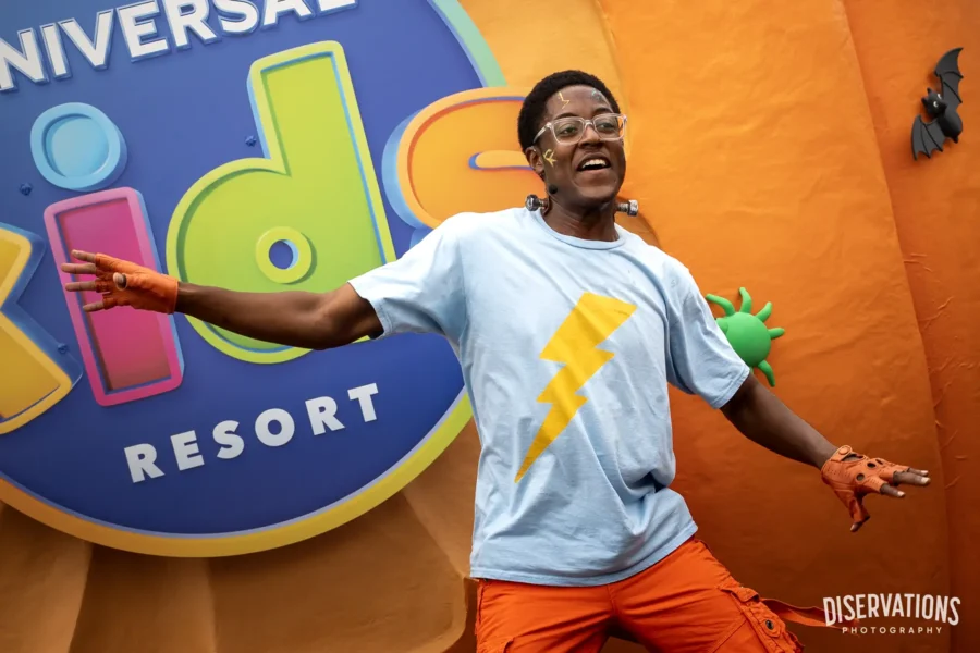 Frankie in front of the Universal Kids Resort logo