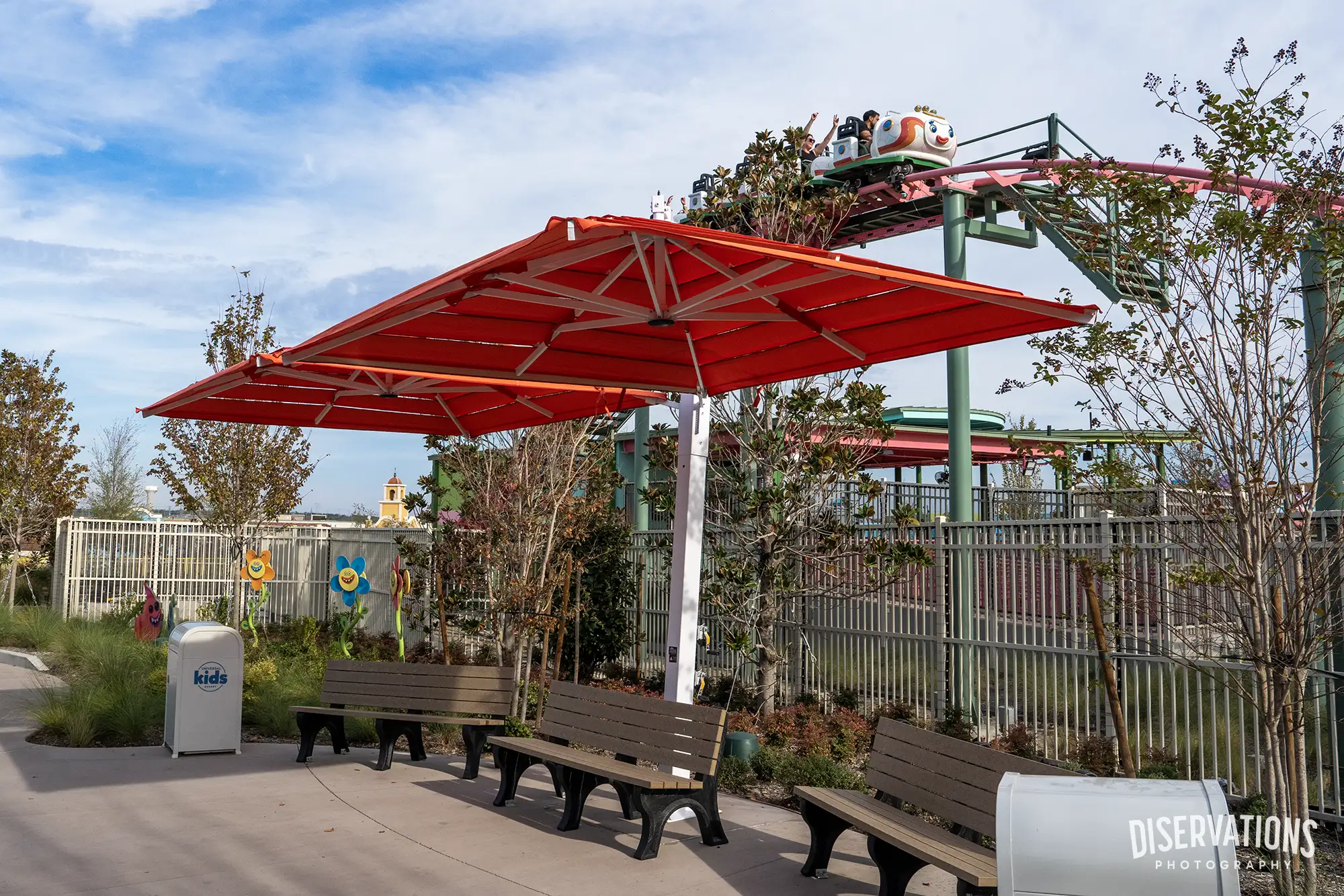 Rhonda's TrollsFest Express visible and shade umbrellas at Universal Kids Resort